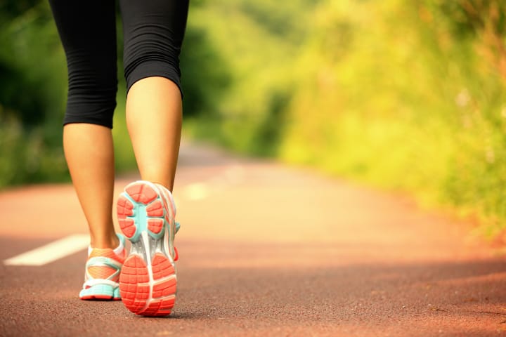 woman walking trail